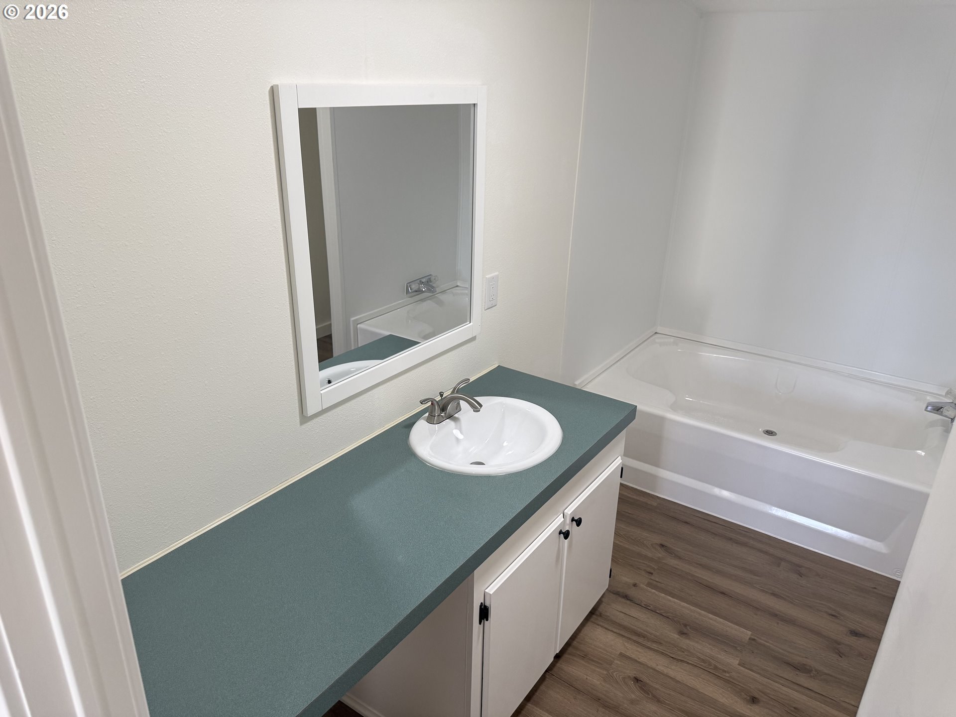 20140 Northeast Sandy Boulevard, Unit 103 Fairview, OR 97024 - Photo 5 of 15 a bathroom with a sink and a mirror