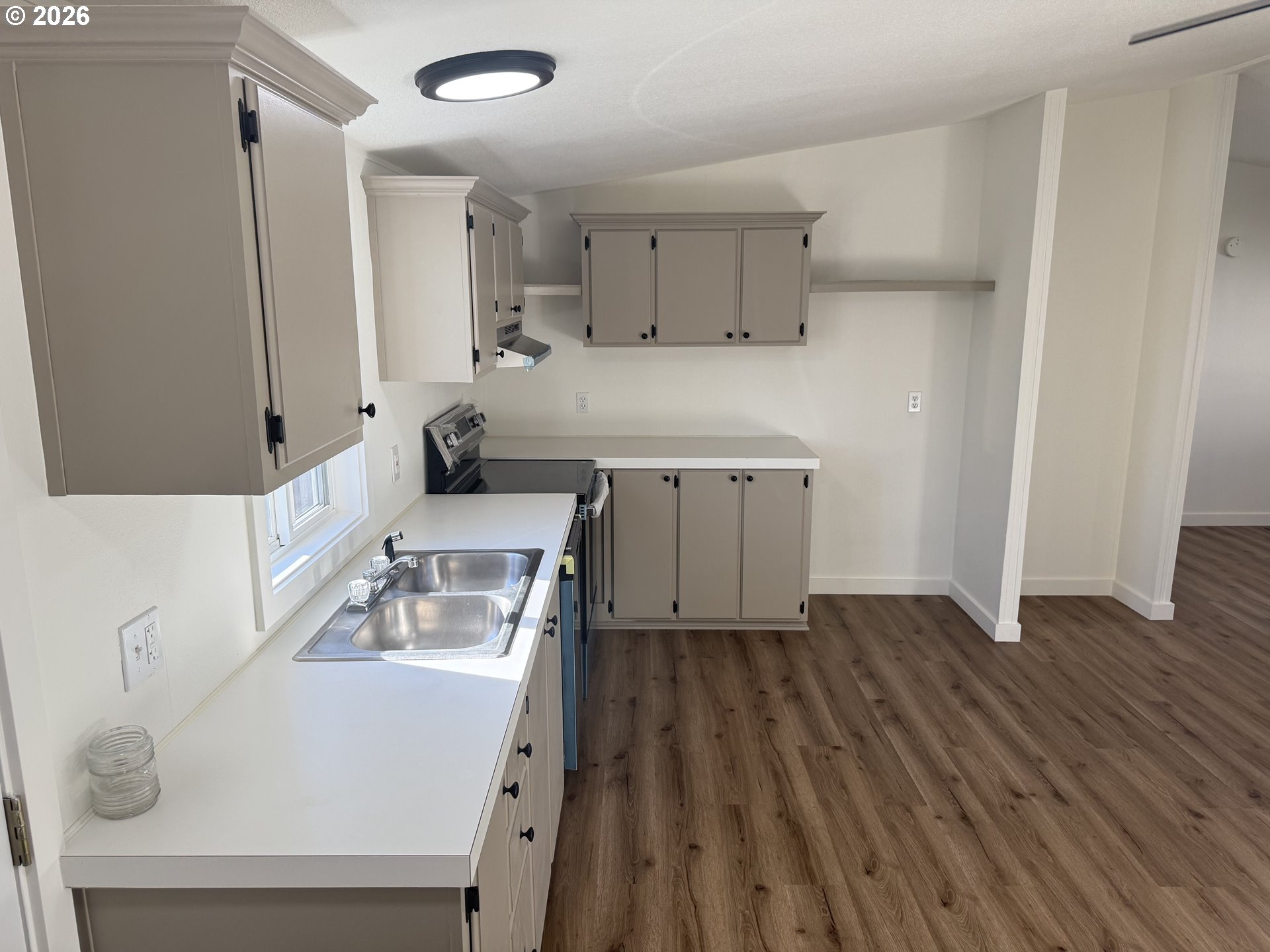 20140 Northeast Sandy Boulevard, Unit 103 Fairview, OR 97024 - Photo 10 of 15 a kitchen with a sink appliances and cabinets