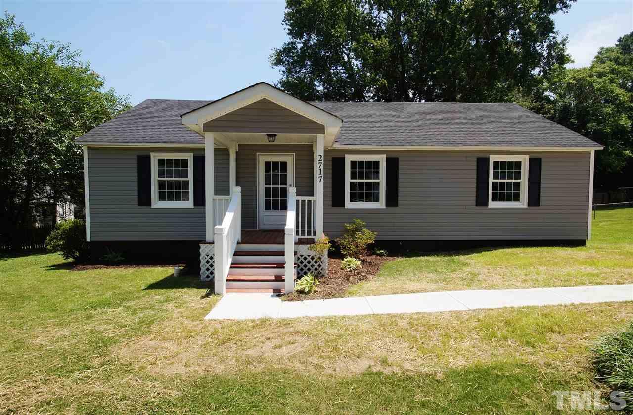 2717 Knowles Street Raleigh, NC 27603 - Photo 1 of 26 a front view of a house with a yard