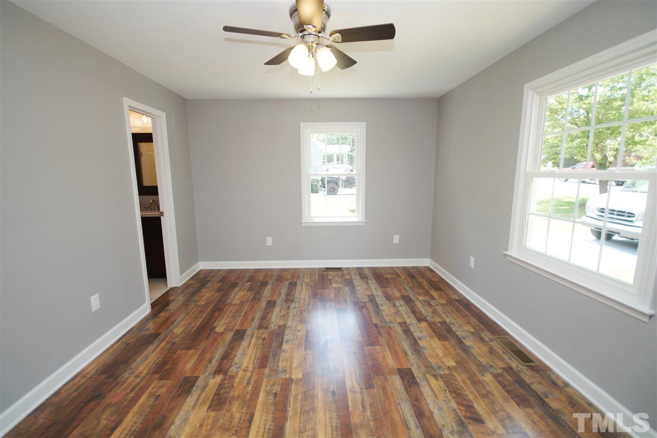 2717 Knowles Street Raleigh, NC 27603 - Photo 15 of 26 wooden floor in an empty room with a window