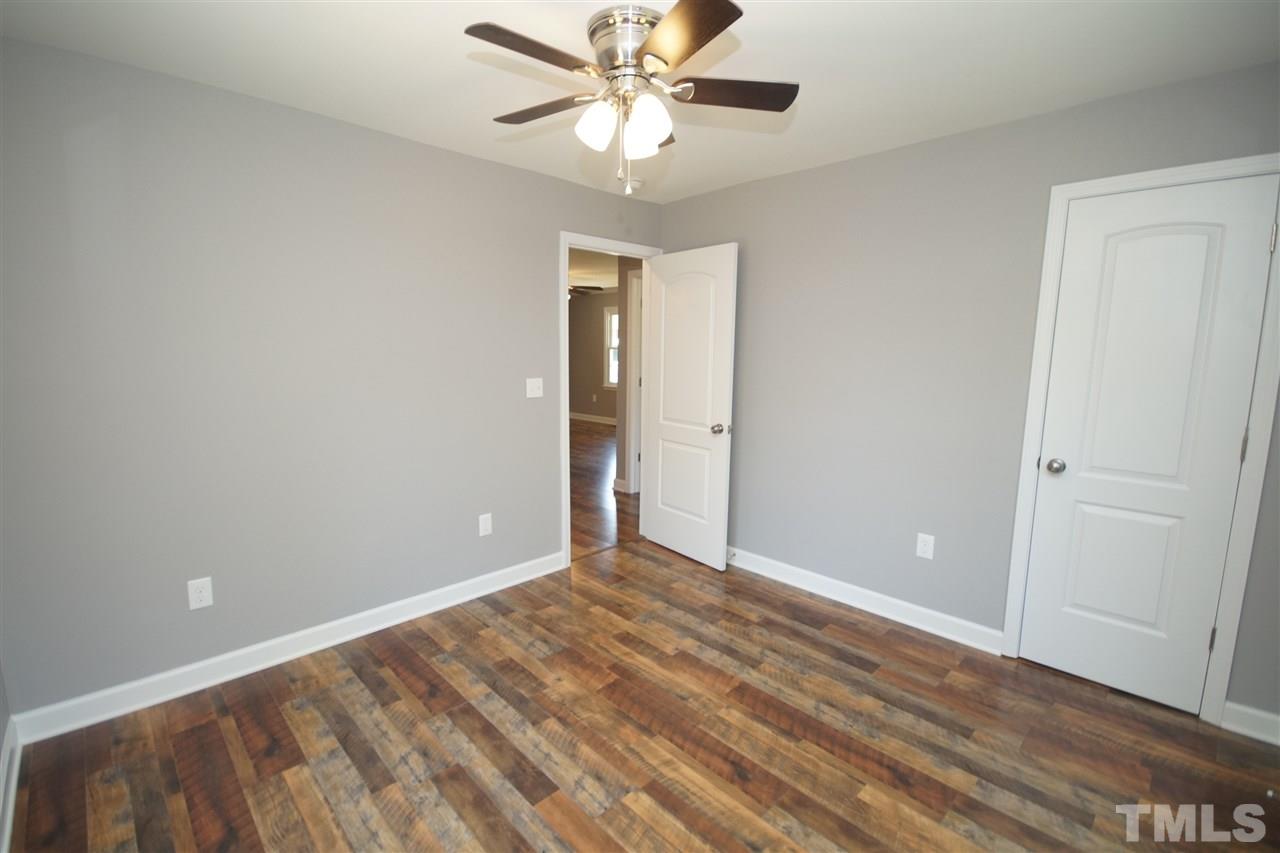 2717 Knowles Street Raleigh, NC 27603 - Photo 21 of 26 a view of an empty room with a window