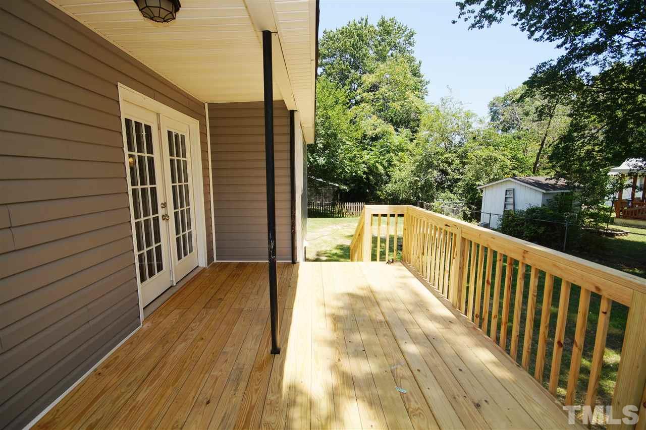 2717 Knowles Street Raleigh, NC 27603 - Photo 24 of 26 a view of balcony with wooden floor and fence