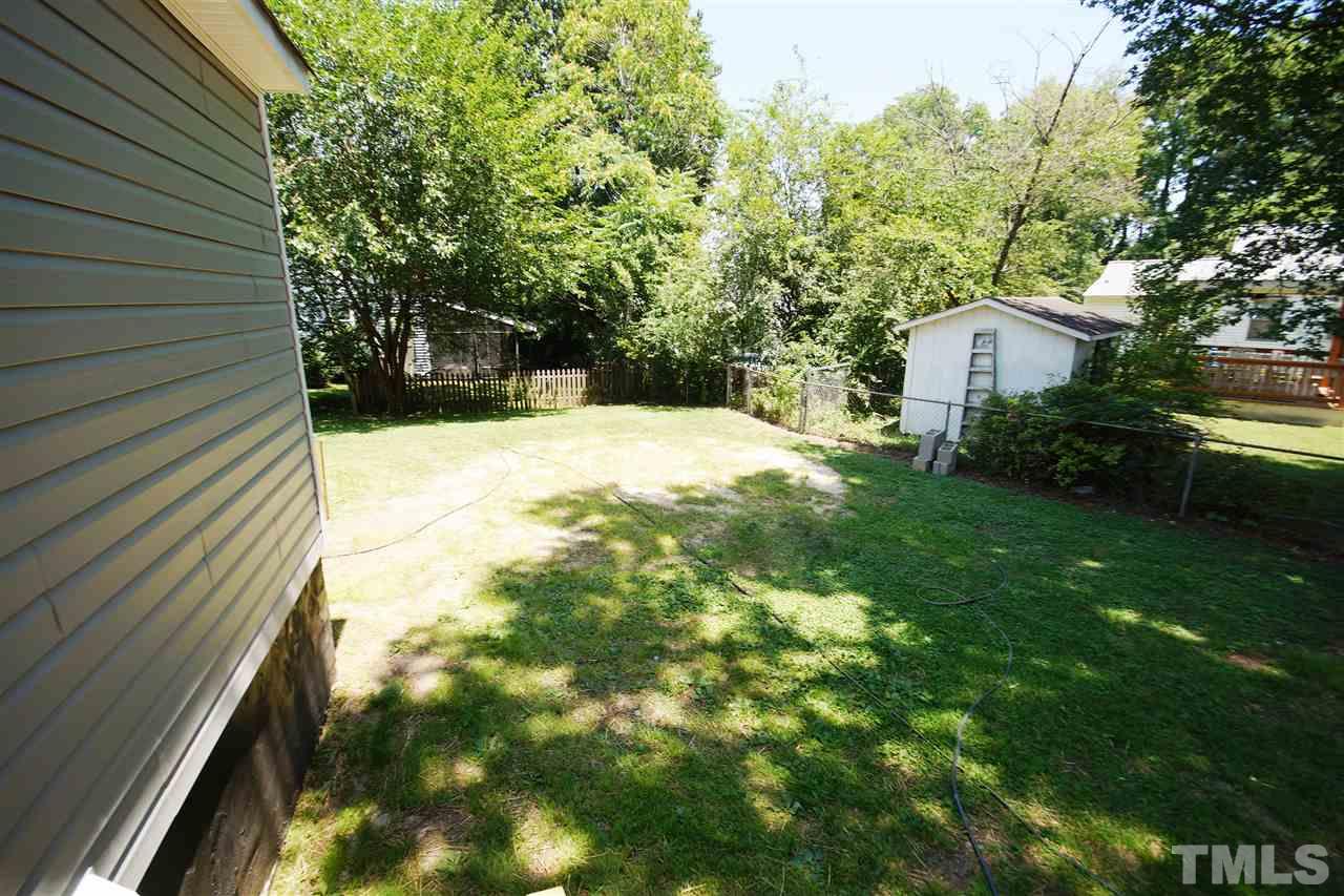 2717 Knowles Street Raleigh, NC 27603 - Photo 26 of 26 a view of backyard with a garden and trees