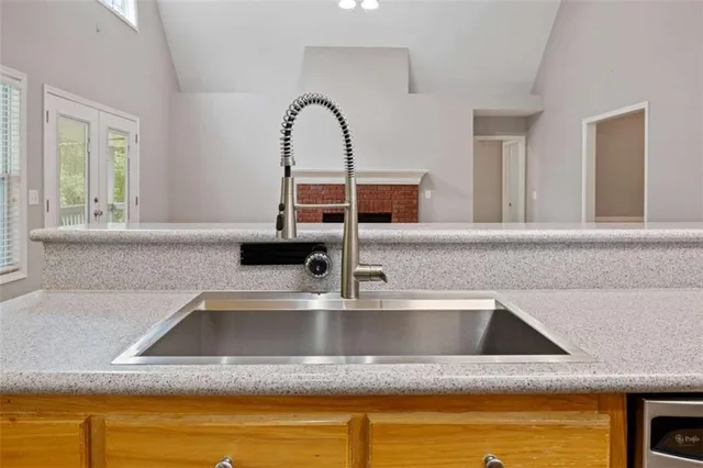 a view of a room with windows and chandelier