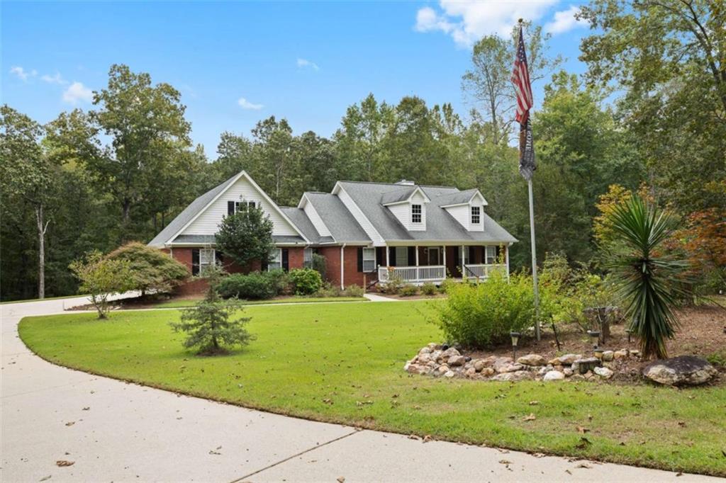9375 Brian Boulevard Winston, GA 30187 - Photo 2 of 70 a front view of a house with garden