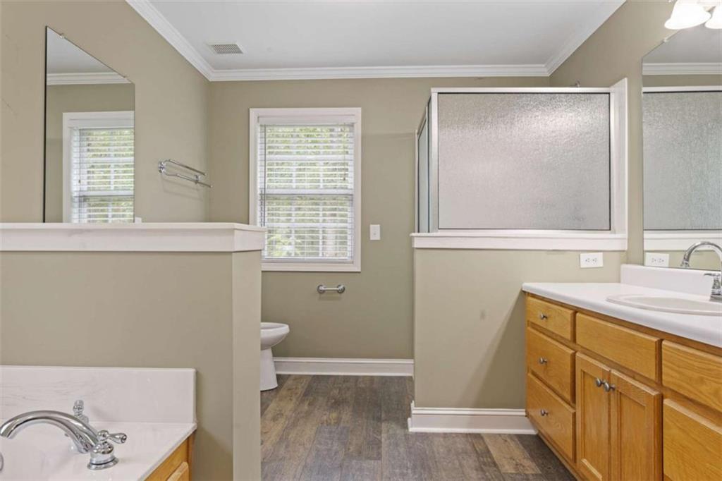 9375 Brian Boulevard Winston, GA 30187 - Photo 33 of 70 a bathroom with a sink a toilet and a window