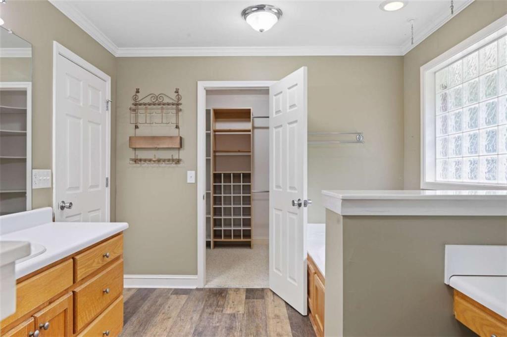 9375 Brian Boulevard Winston, GA 30187 - Photo 34 of 70 a kitchen with stainless steel appliances cabinets and a wooden floor