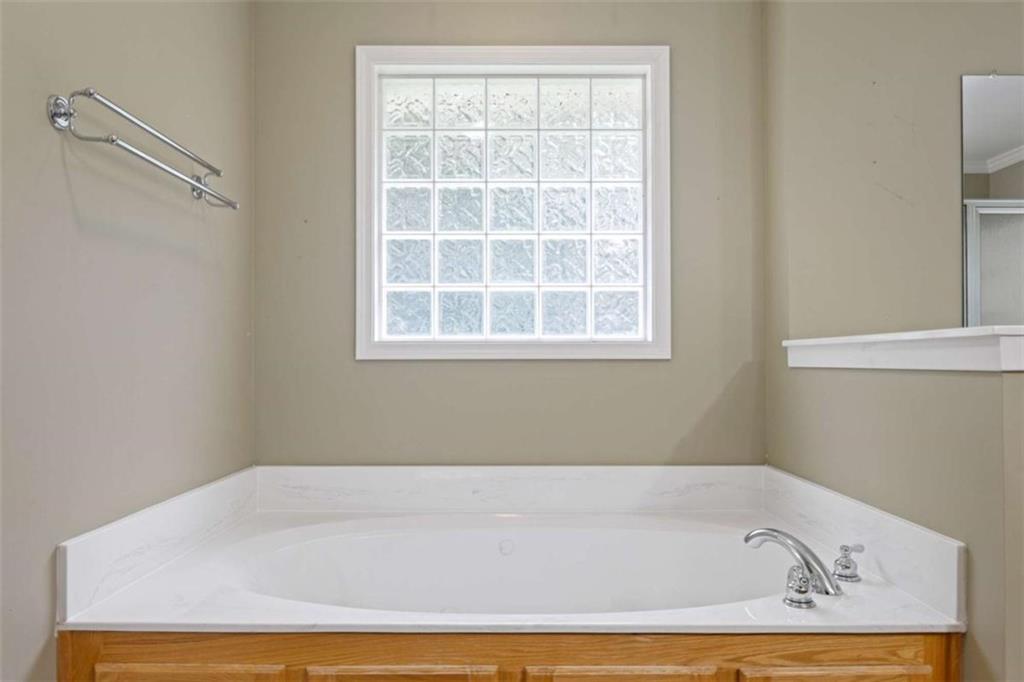 9375 Brian Boulevard Winston, GA 30187 - Photo 36 of 70 a bathroom with bathtub and window