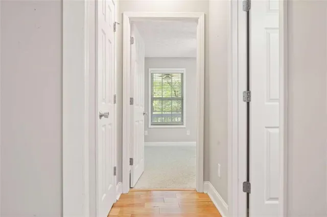 a white toilet sitting next to a shower