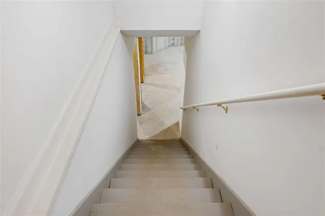 a backyard of a house with a trees and plants