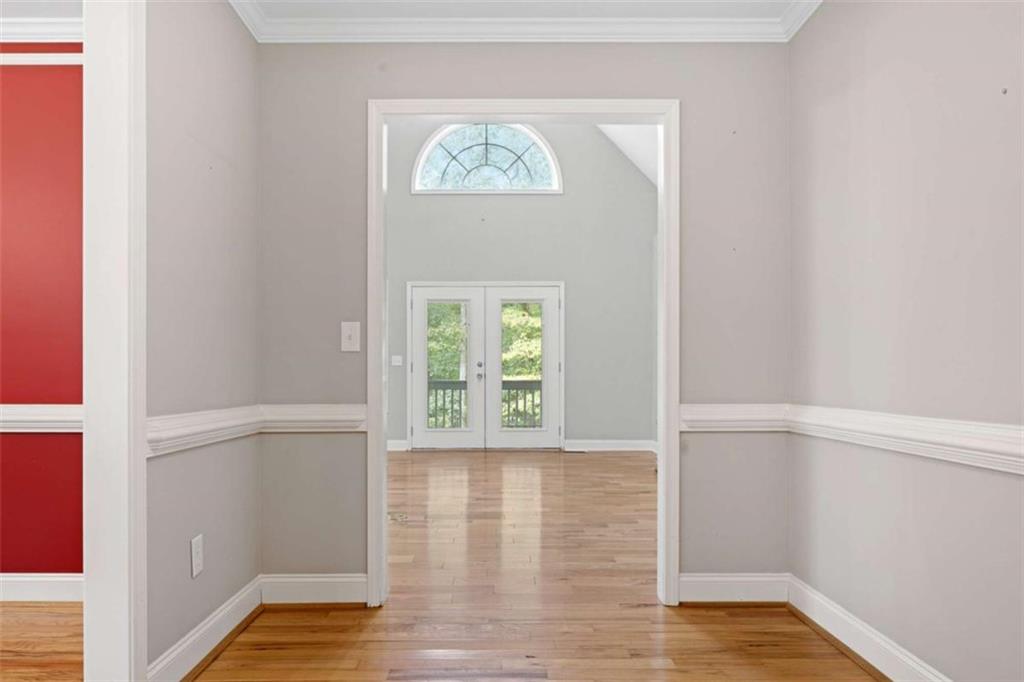 9375 Brian Boulevard Winston, GA 30187 - Photo 6 of 70 a view of an empty room with wooden floor and a window