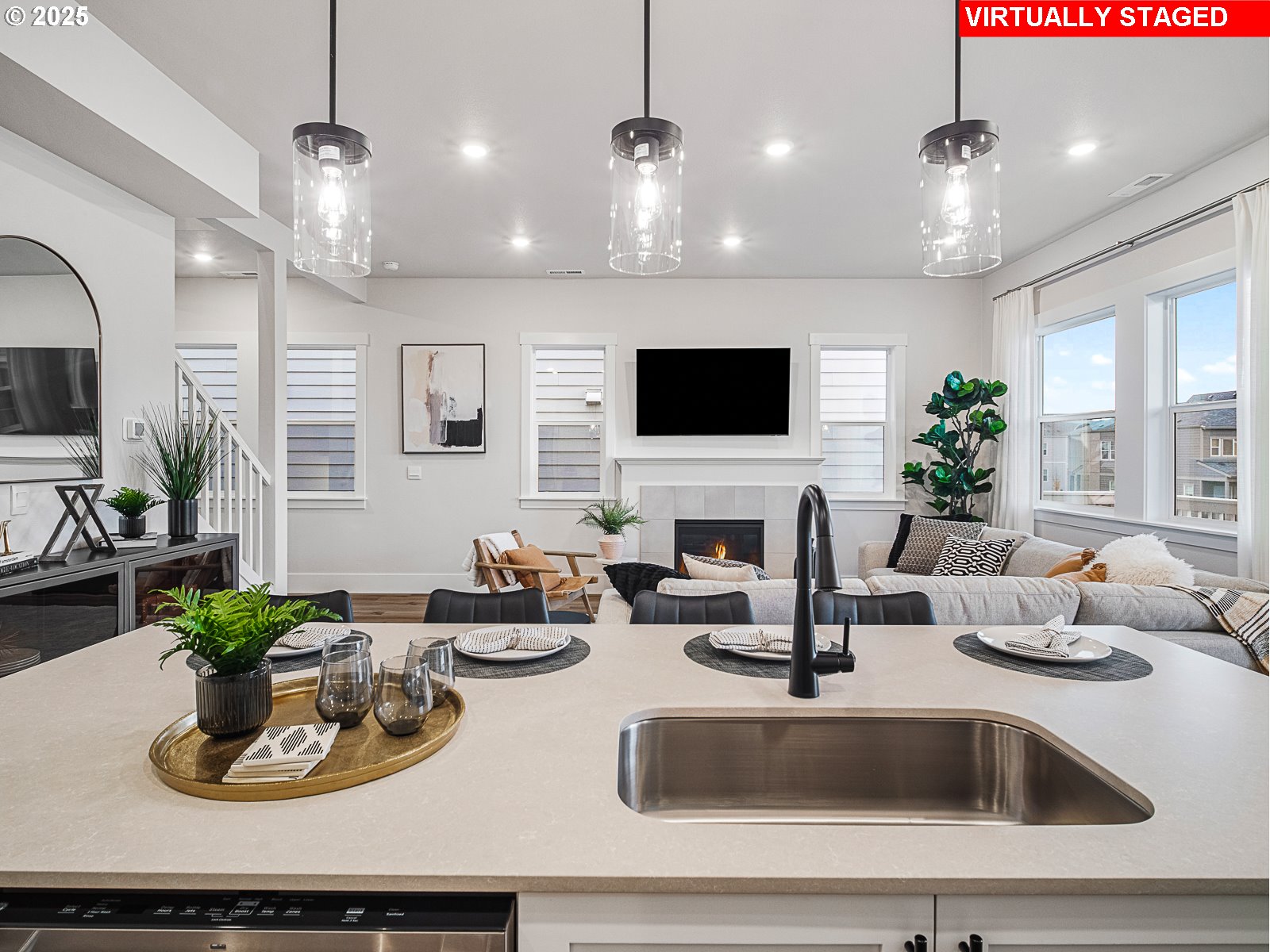 18045 Southwest Monashee Lane Beaverton, OR 97007 - Photo 5 of 45 a kitchen with a faucet a sink and living room view