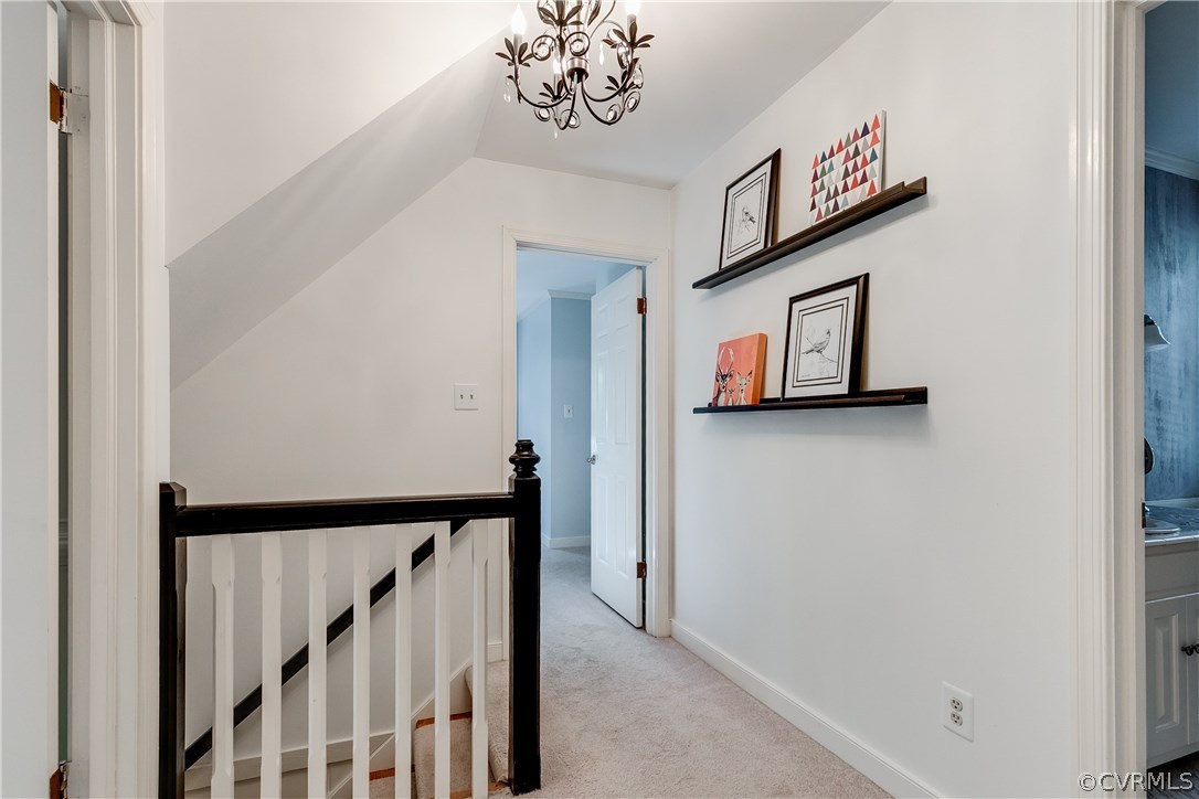 13507 Queensgate Road Midlothian, VA 23114 - Photo 24 of 45 a view of a hallway with paintings on the wall