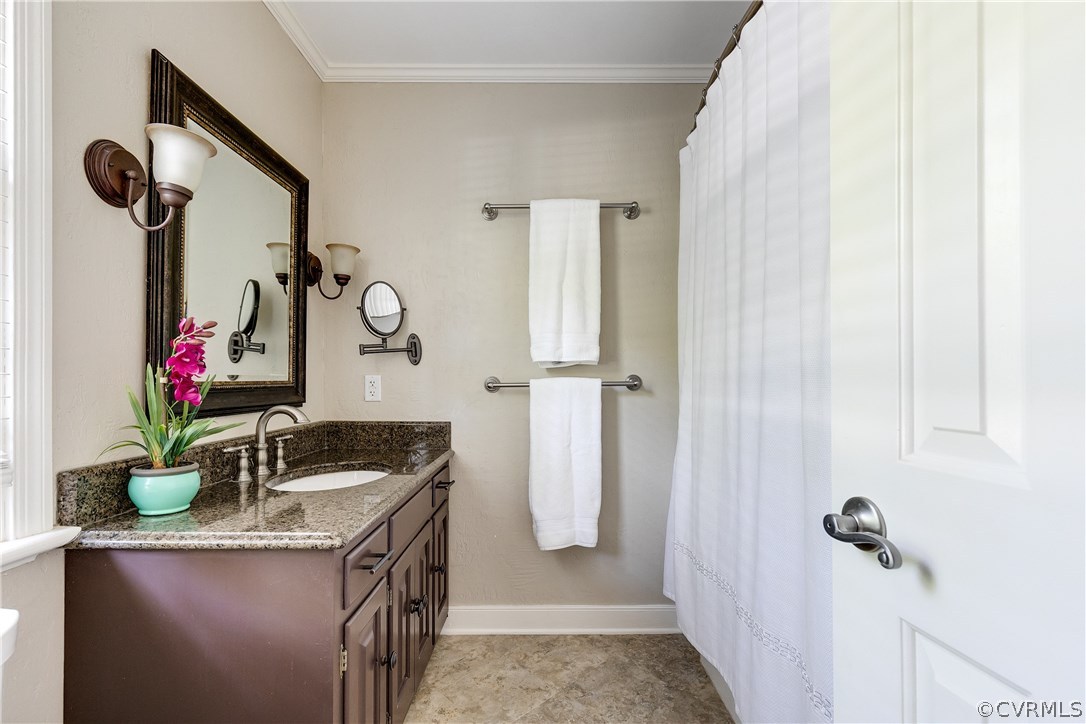 13507 Queensgate Road Midlothian, VA 23114 - Photo 28 of 45 a bathroom with a granite countertop sink a mirror and shower