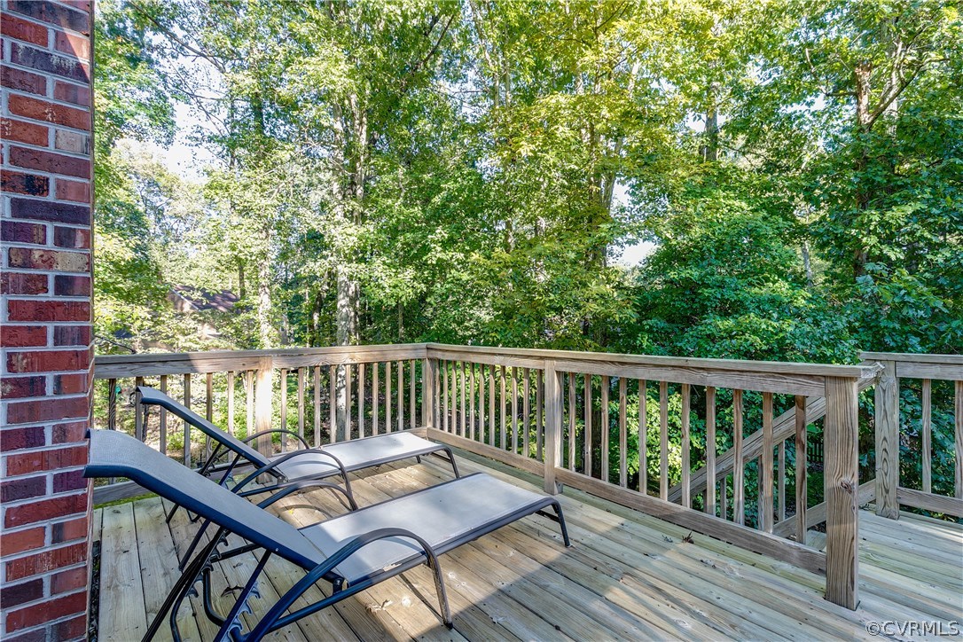 13507 Queensgate Road Midlothian, VA 23114 - Photo 42 of 45 a view of a balcony with wooden floor and outdoor seating