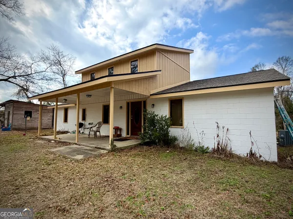 a view of house with outdoor space