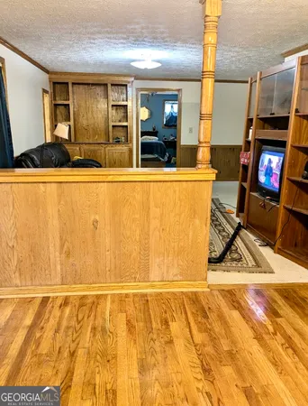 a view of living room and kitchen