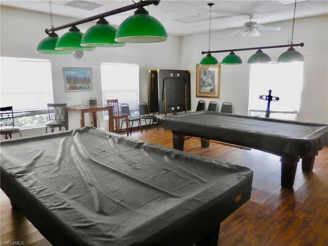 a view of a kitchen with kitchen island a sink and a stove