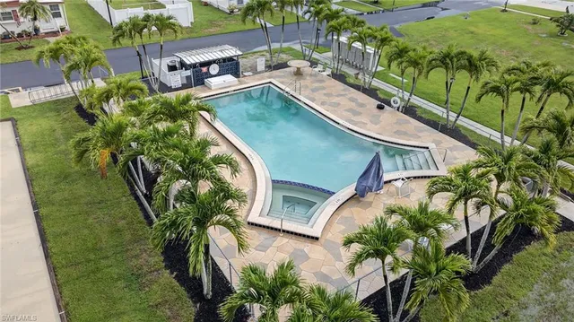 an aerial view of a house with outdoor space and street view