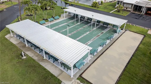 a view of a backyard with sitting area