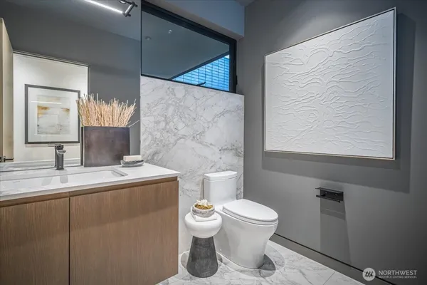 a spacious bedroom with a large bed and a large window