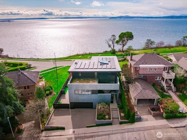 a view of a porch with a table and chairs