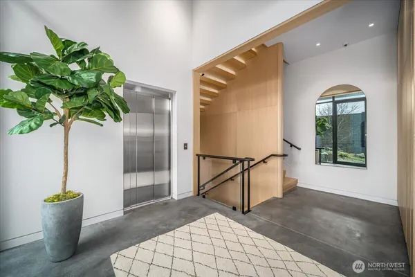 a large white kitchen with a large window