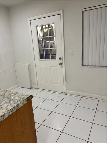 a view of an empty room with windows