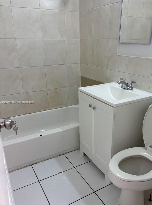 2070 Washington Avenue, Unit 2 Opa-Locka, FL 33054 - Photo 6 of 6 a bathroom with a sink a toilet and bathtub