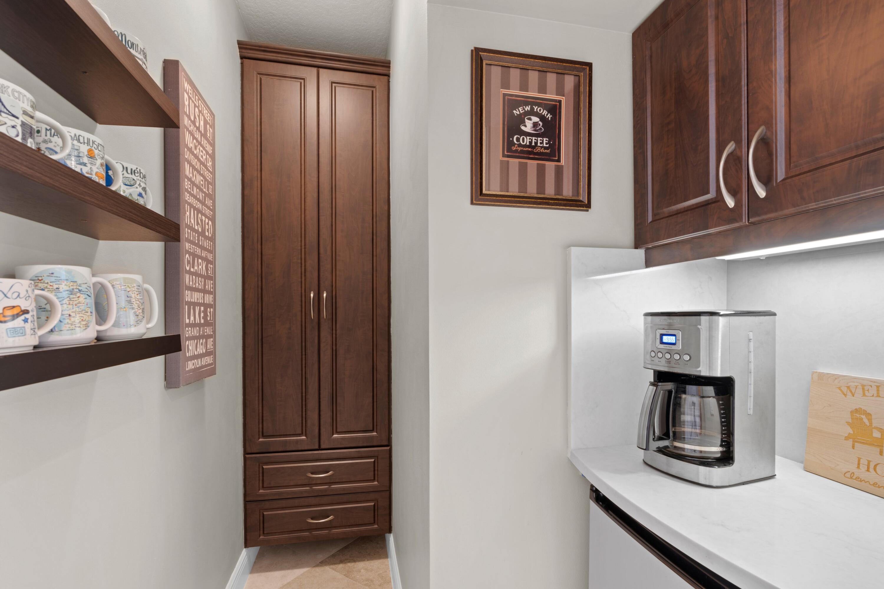 648 Northeast Francesca Lane Boca Raton, FL 33487 - Photo 12 of 40 a kitchen with a refrigerator and cabinets
