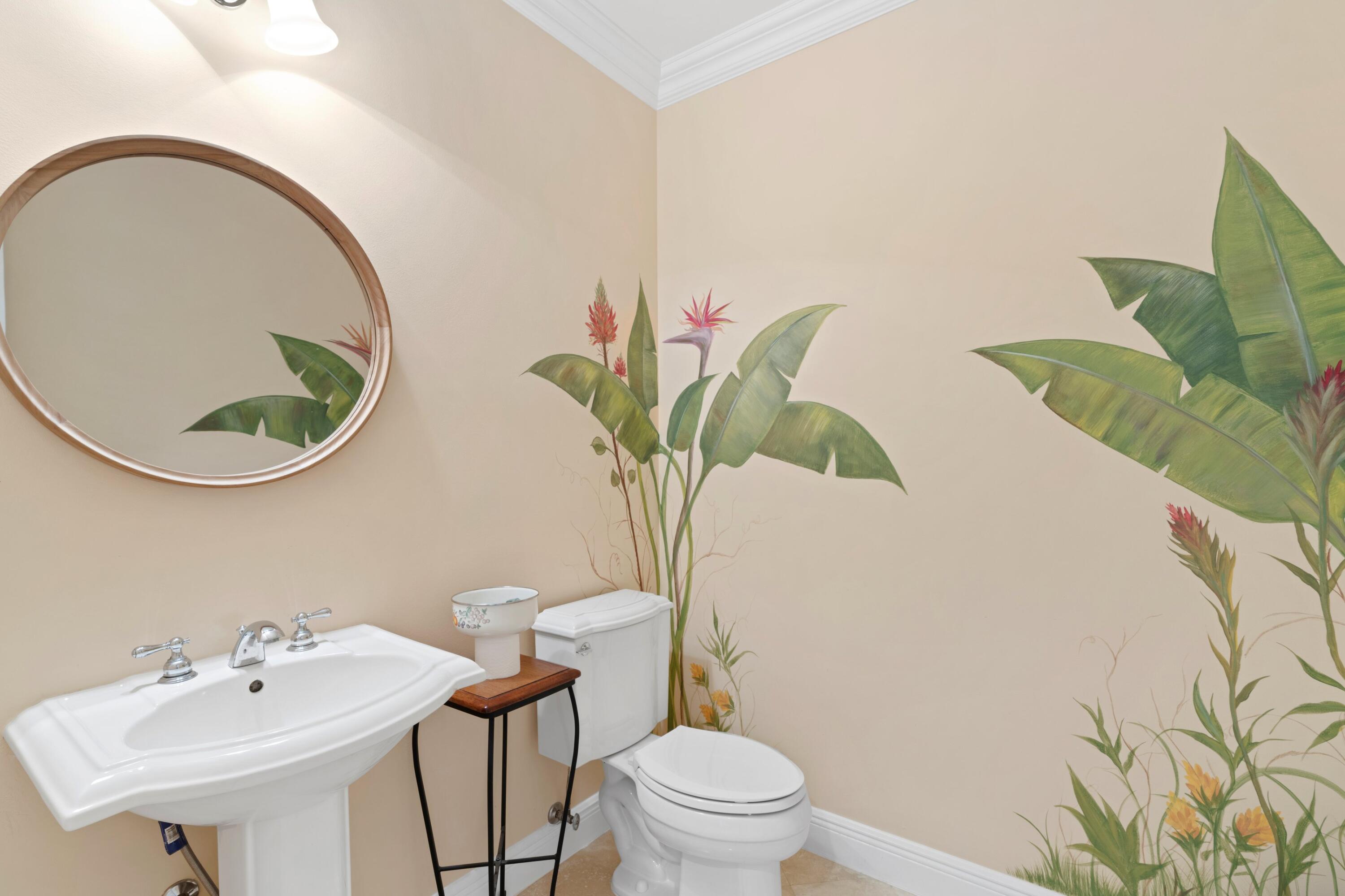 648 Northeast Francesca Lane Boca Raton, FL 33487 - Photo 13 of 40 a bathroom with a toilet sink and mirror