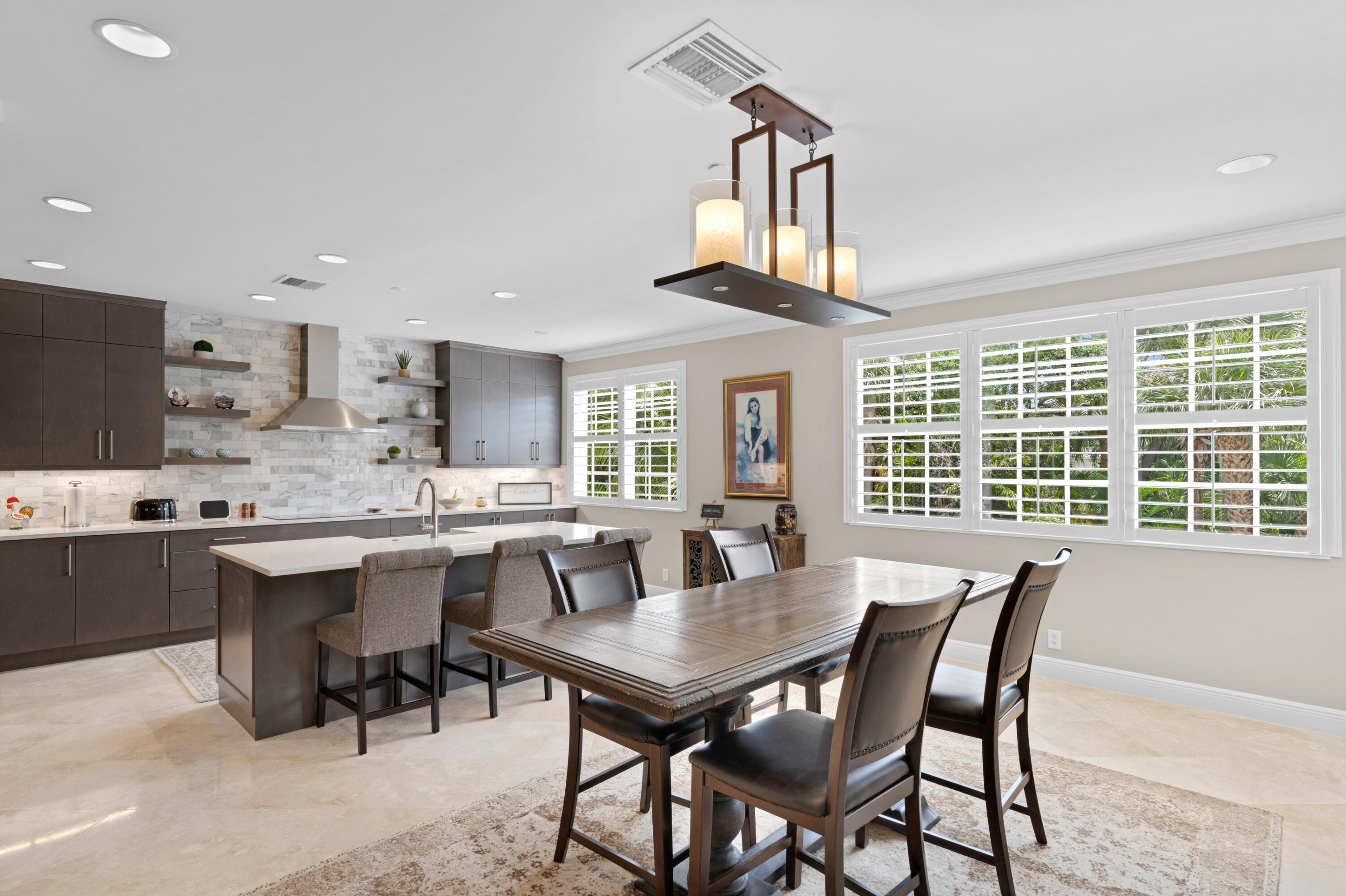 648 Northeast Francesca Lane Boca Raton, FL 33487 - Photo 14 of 40 a dining room with a large window table and chairs