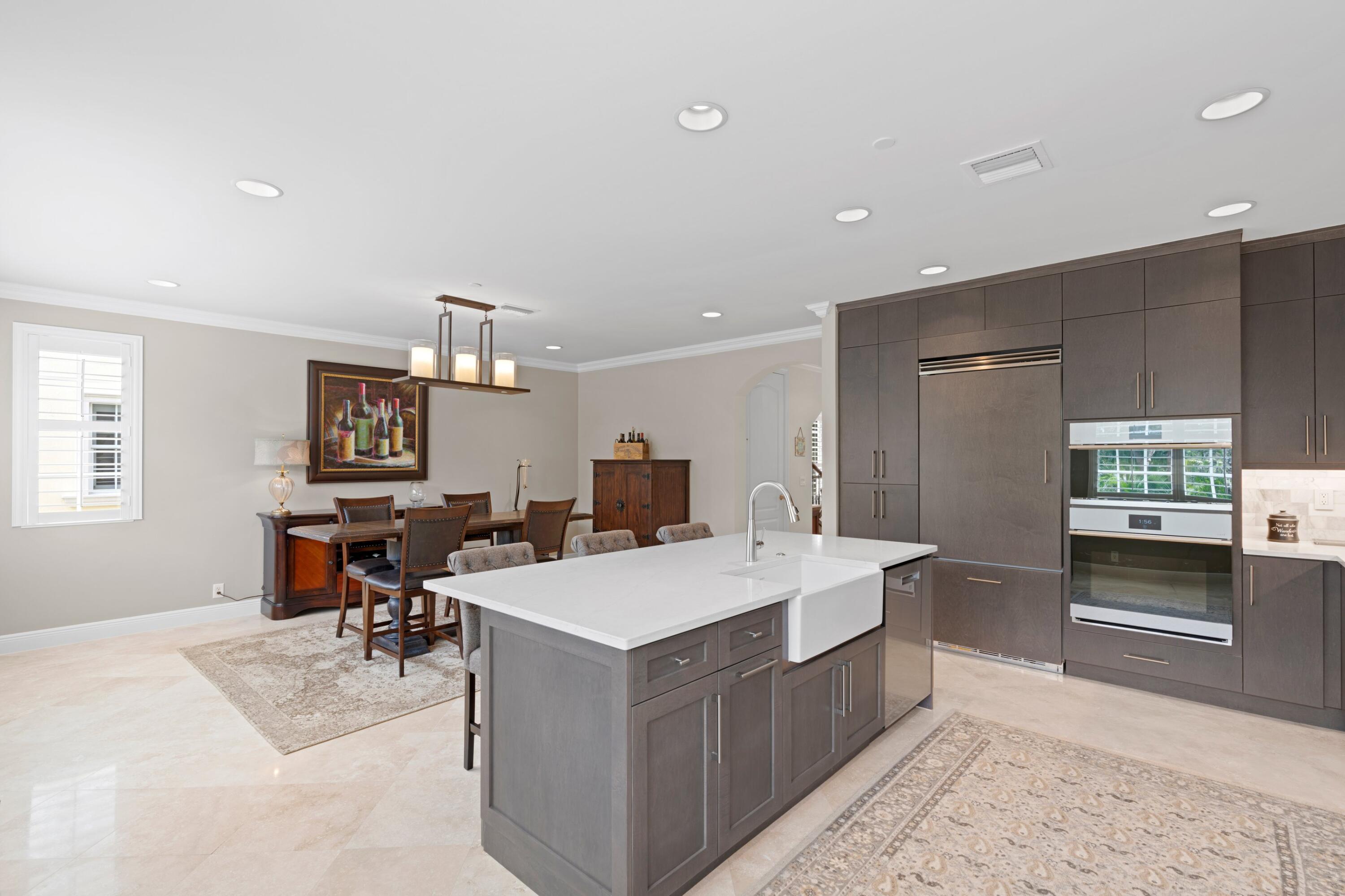 648 Northeast Francesca Lane Boca Raton, FL 33487 - Photo 18 of 40 a large white kitchen with a stove a sink dishwasher and a refrigerator