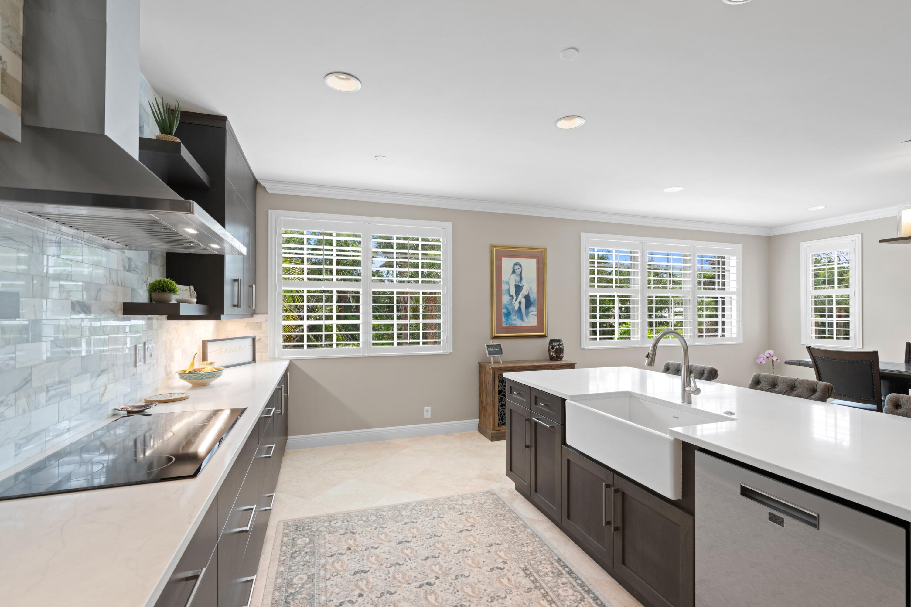 648 Northeast Francesca Lane Boca Raton, FL 33487 - Photo 19 of 40 a kitchen with a sink and large window