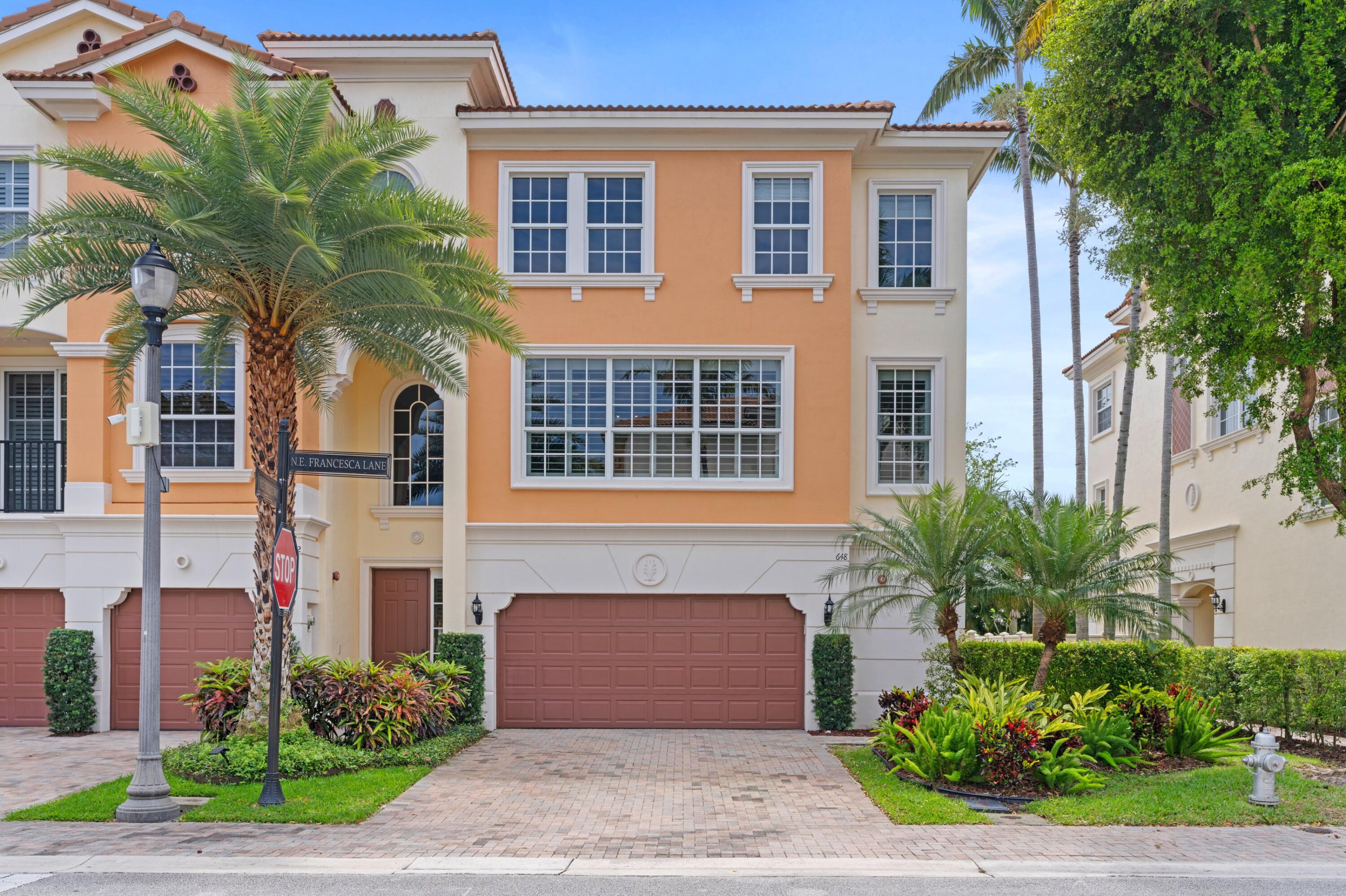 648 Northeast Francesca Lane Boca Raton, FL 33487 - Photo 2 of 40 a front view of a house having yard