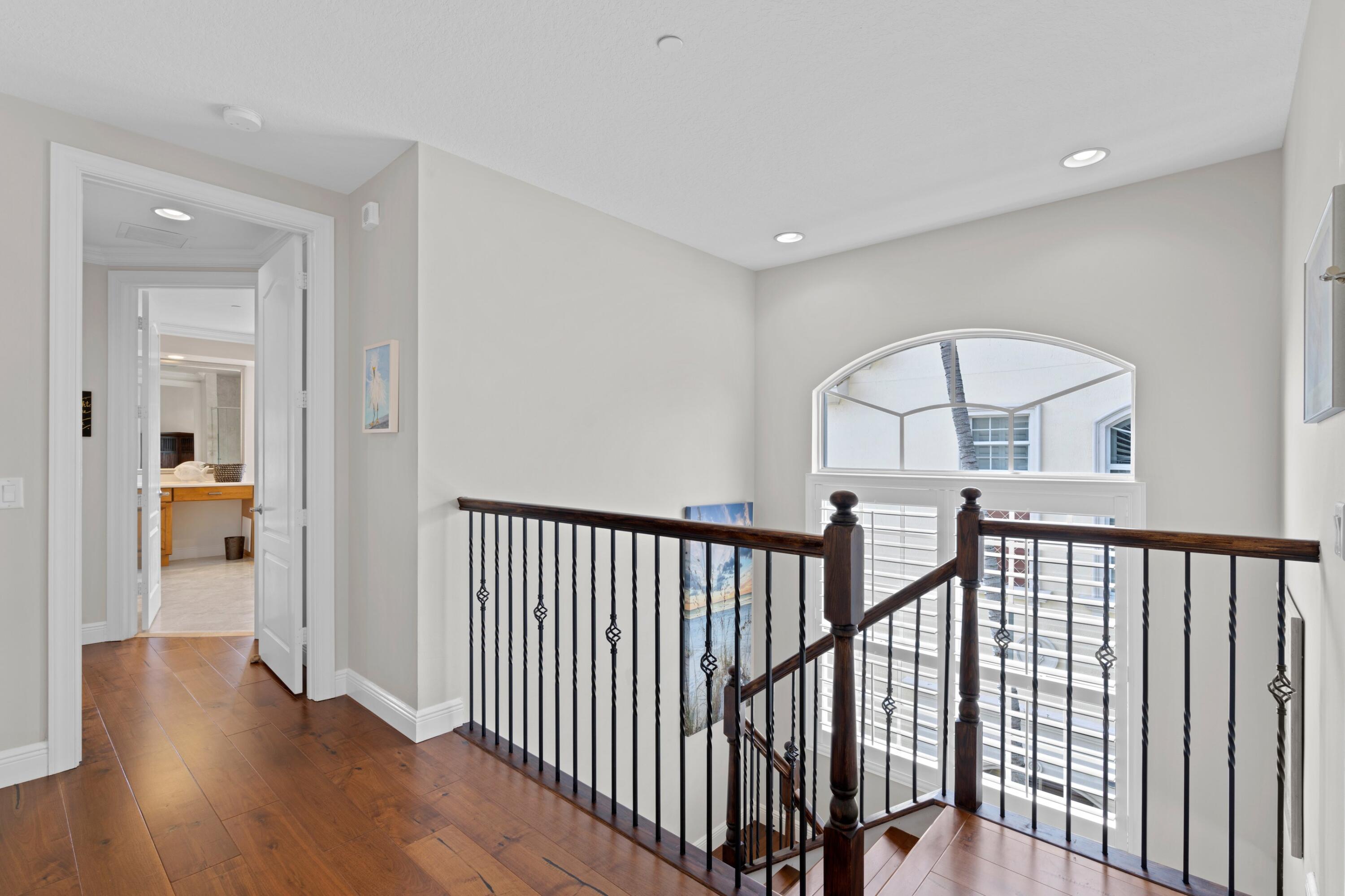 648 Northeast Francesca Lane Boca Raton, FL 33487 - Photo 21 of 40 a view of as hallway with wooden floor and windows