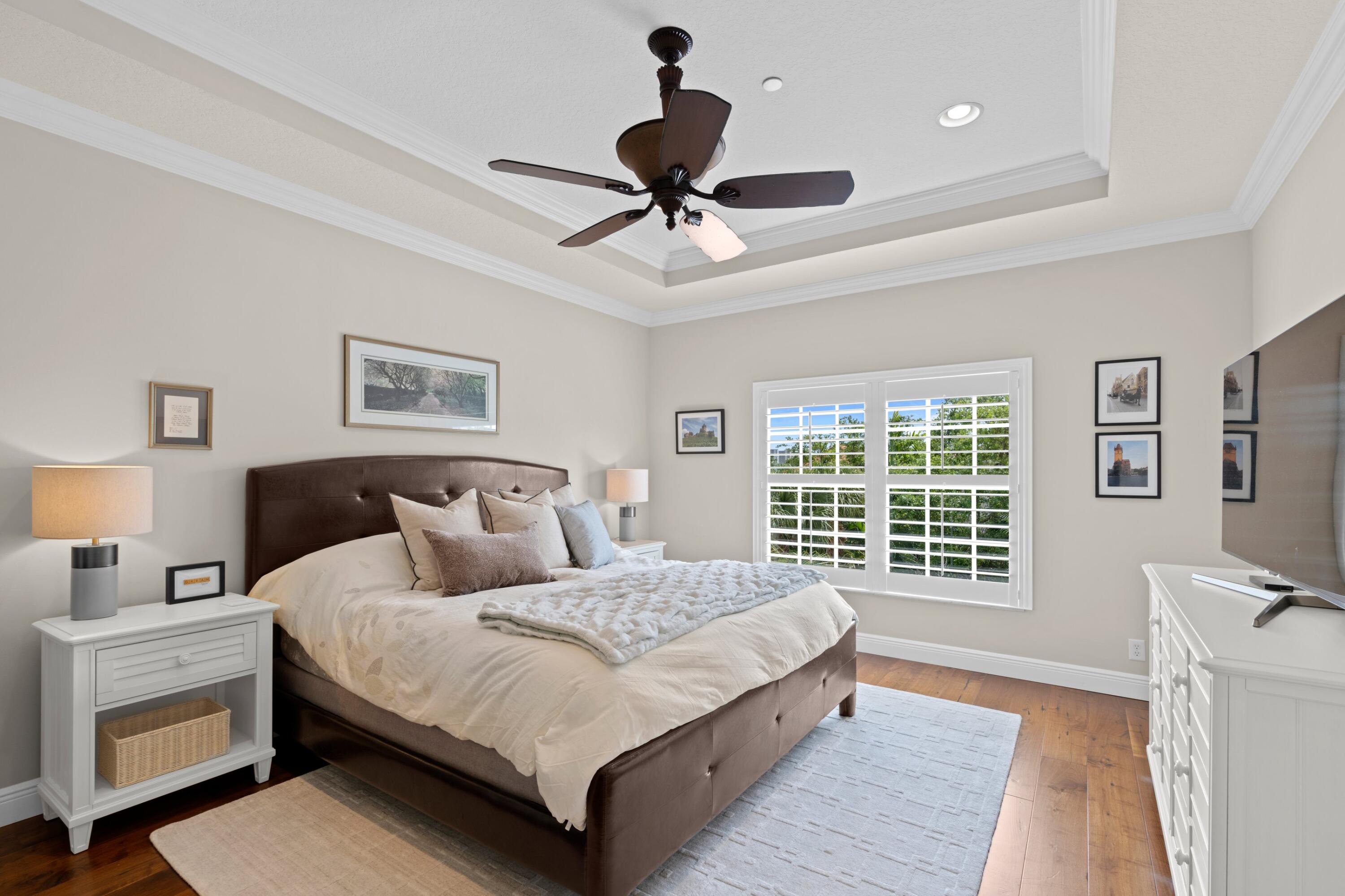 648 Northeast Francesca Lane Boca Raton, FL 33487 - Photo 22 of 40 a bedroom with a large bed and a window