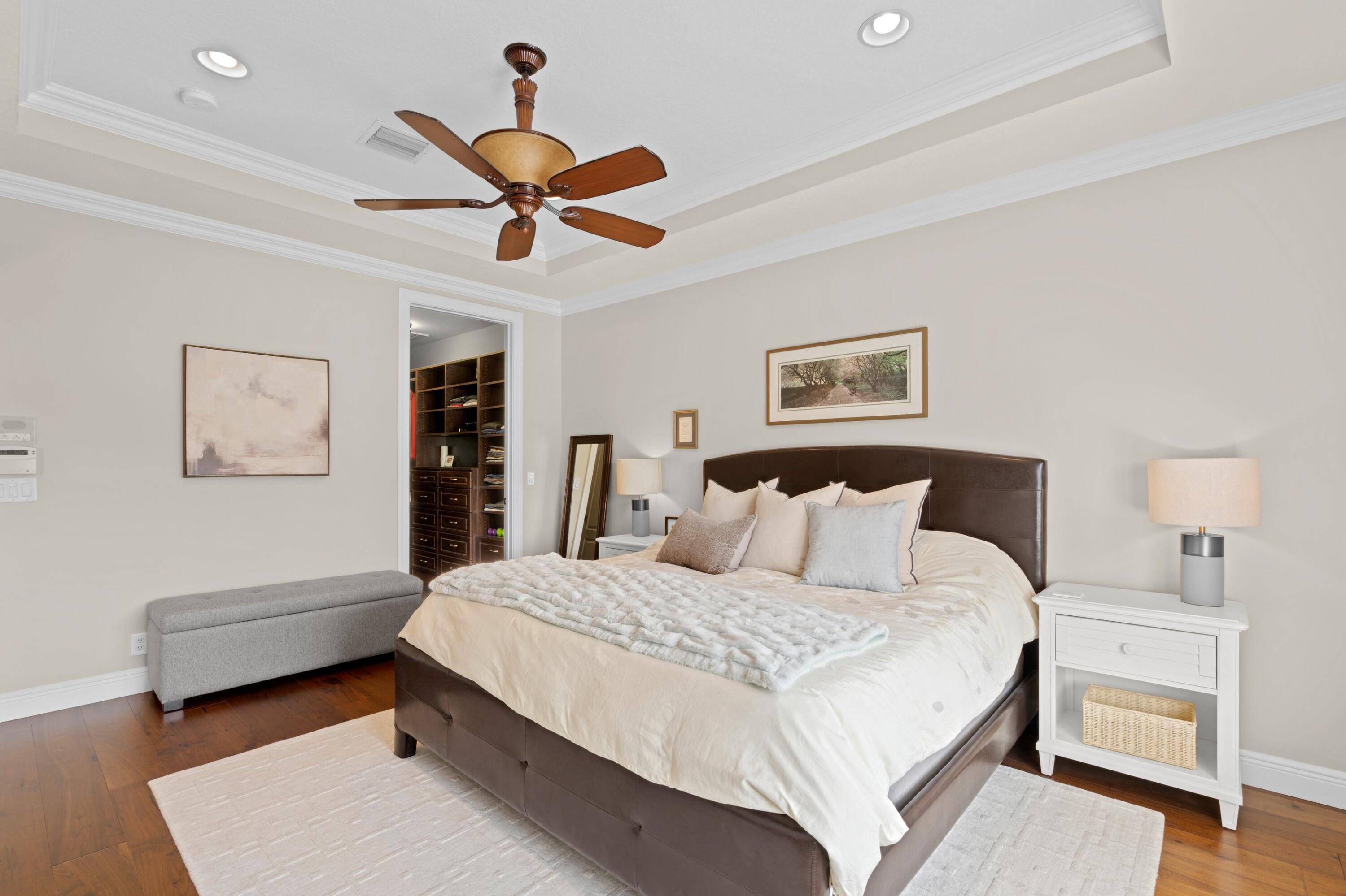 648 Northeast Francesca Lane Boca Raton, FL 33487 - Photo 23 of 40 a bedroom with a bed and a chandelier