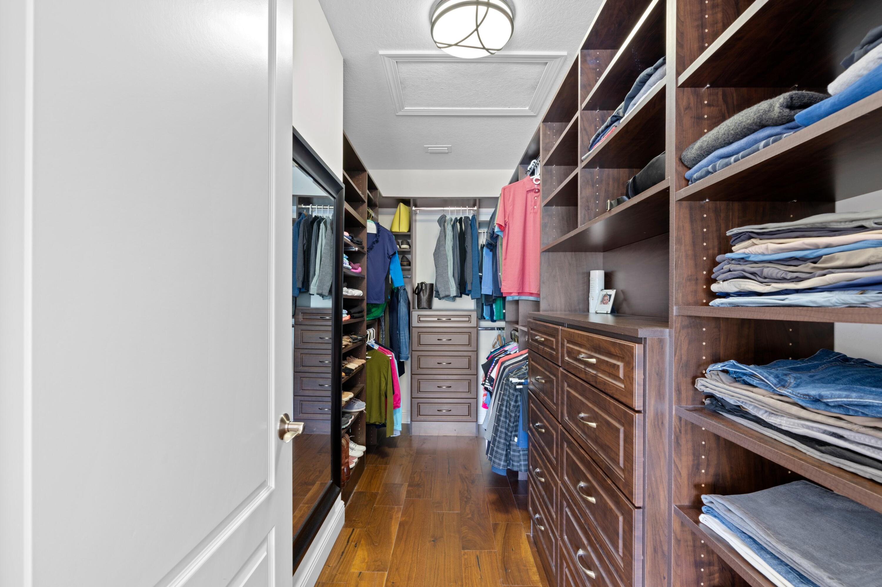 648 Northeast Francesca Lane Boca Raton, FL 33487 - Photo 24 of 40 a view of walk in closet with clothes and shoes