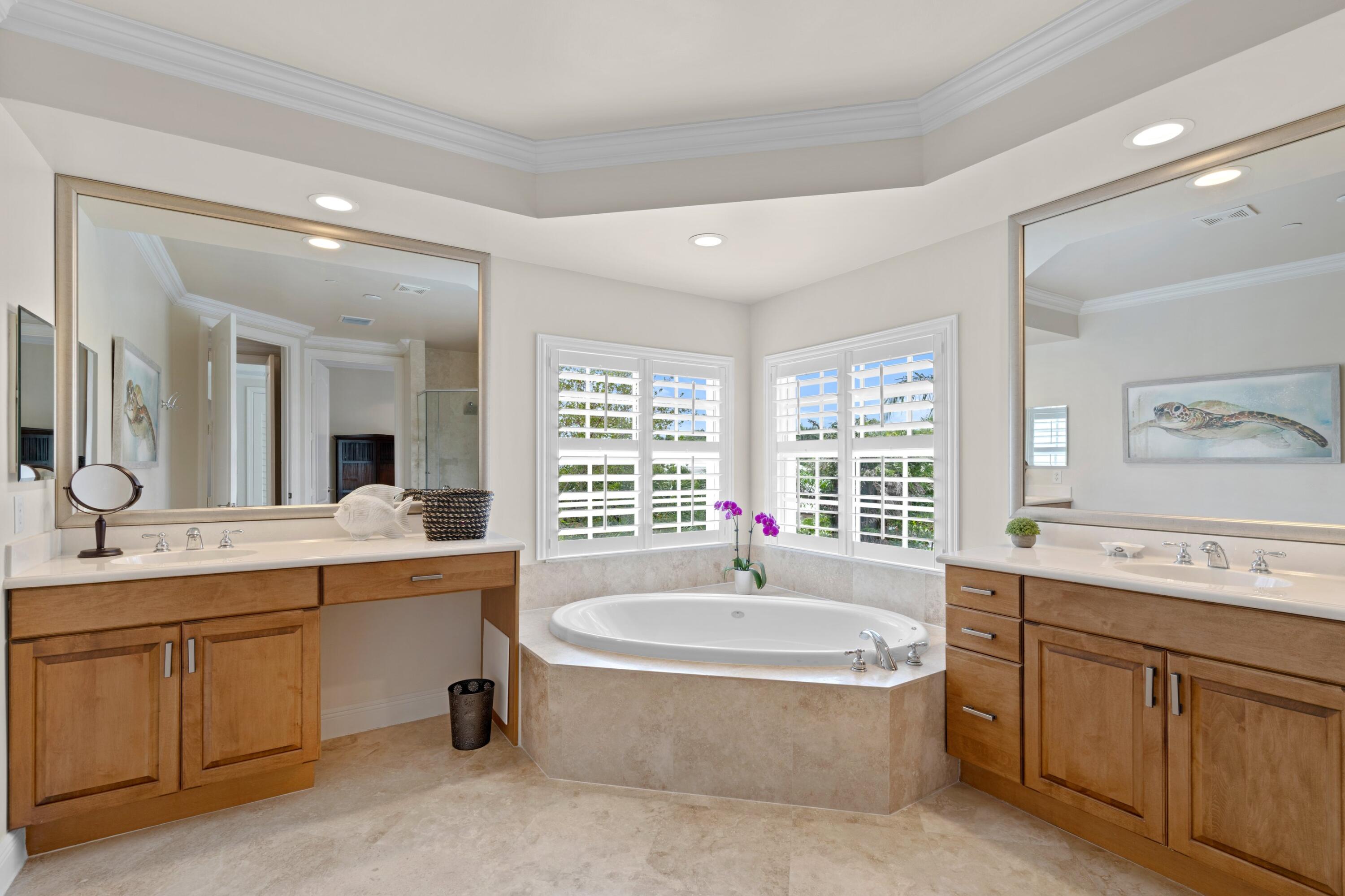 648 Northeast Francesca Lane Boca Raton, FL 33487 - Photo 25 of 40 a bathroom with a tub sink and mirror