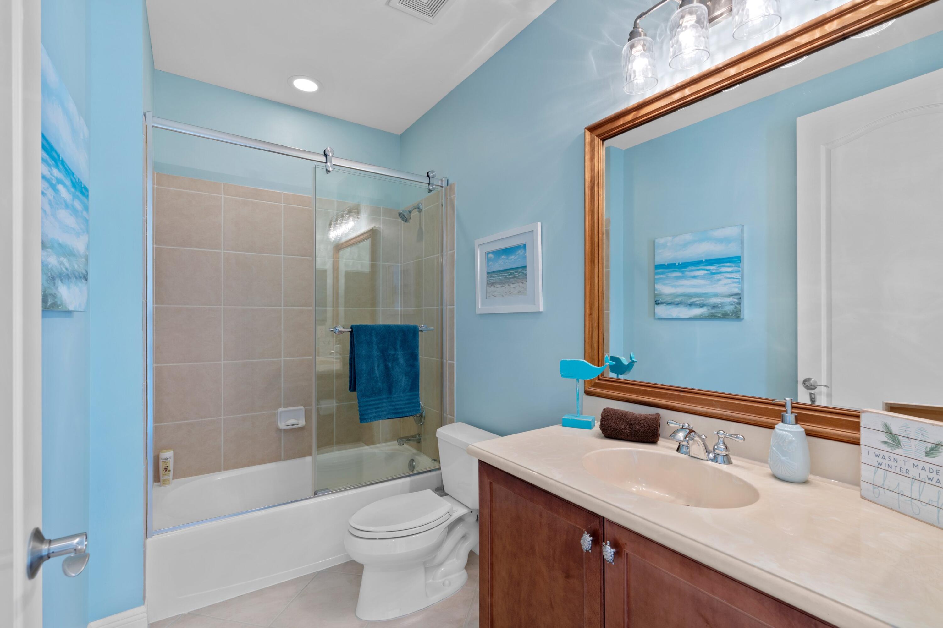 648 Northeast Francesca Lane Boca Raton, FL 33487 - Photo 29 of 40 a bathroom with a sink a toilet and shower