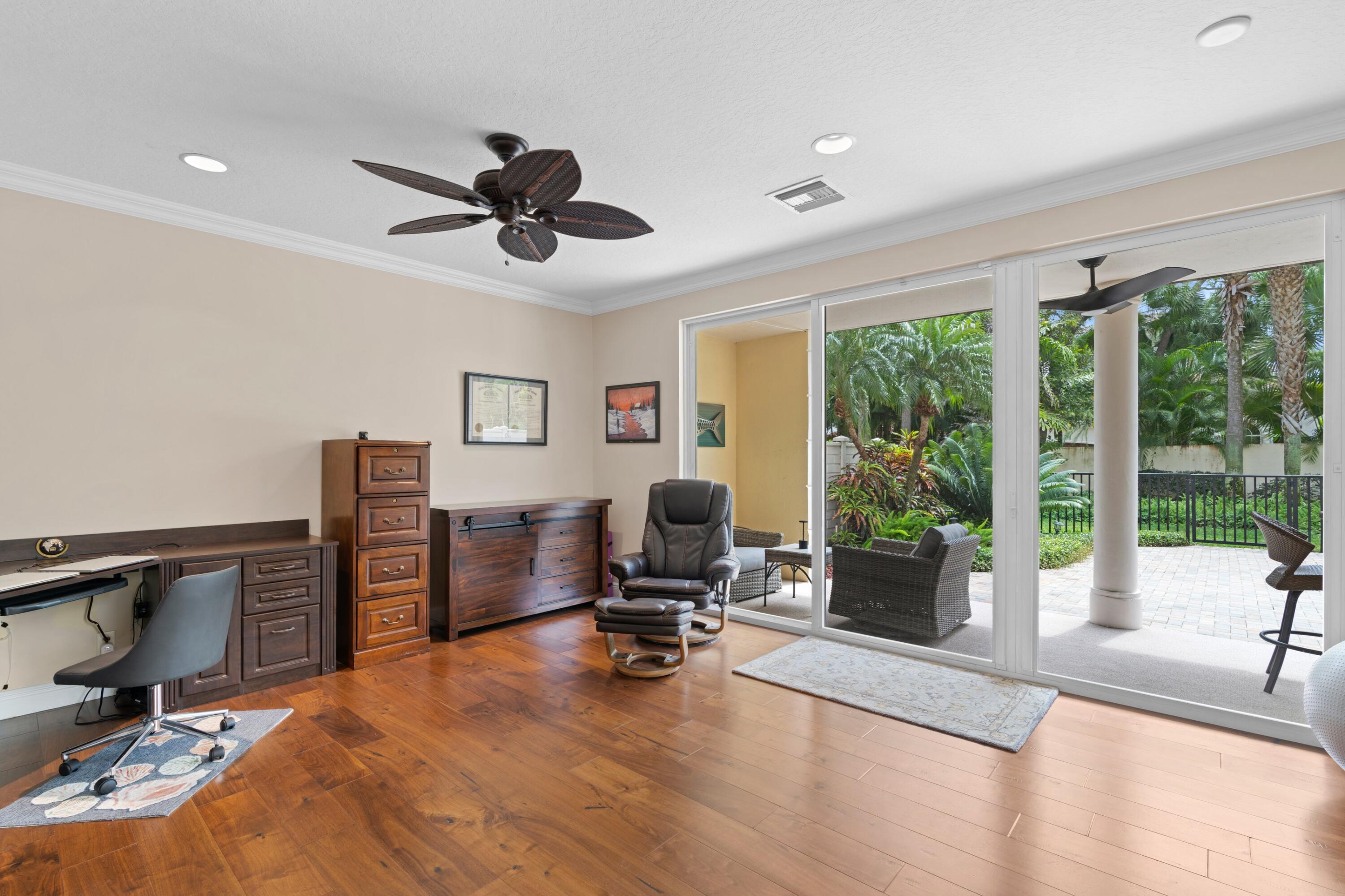 648 Northeast Francesca Lane Boca Raton, FL 33487 - Photo 3 of 40 a view of a workspace with furniture and a window