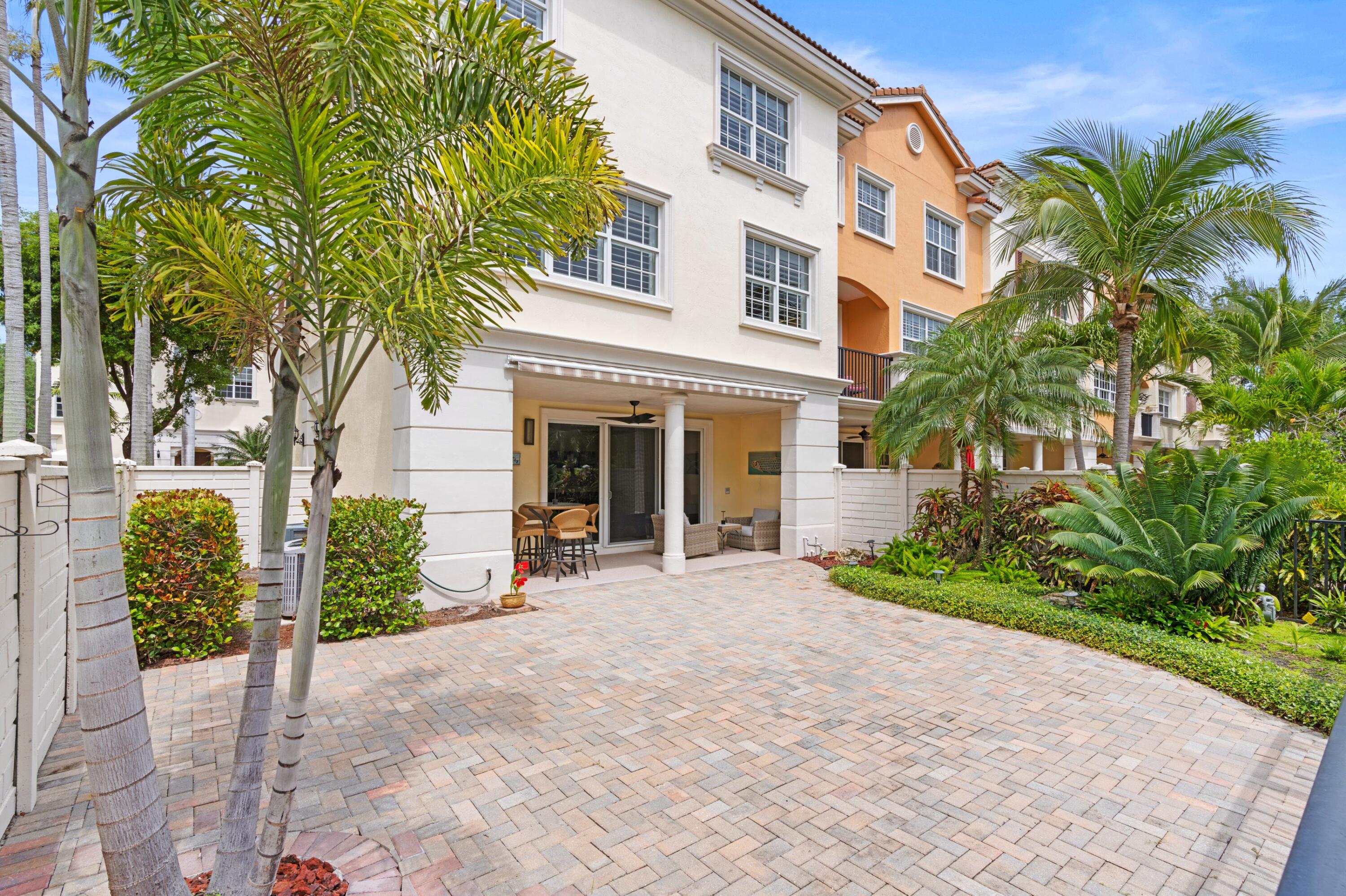 648 Northeast Francesca Lane Boca Raton, FL 33487 - Photo 32 of 40 a front view of a house with garden