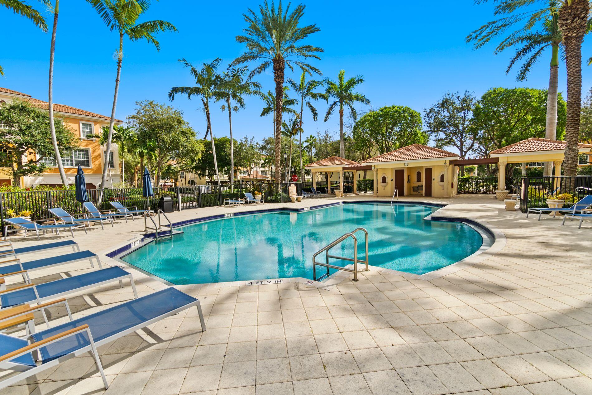 648 Northeast Francesca Lane Boca Raton, FL 33487 - Photo 40 of 40 a view of a swimming pool and trees in the background