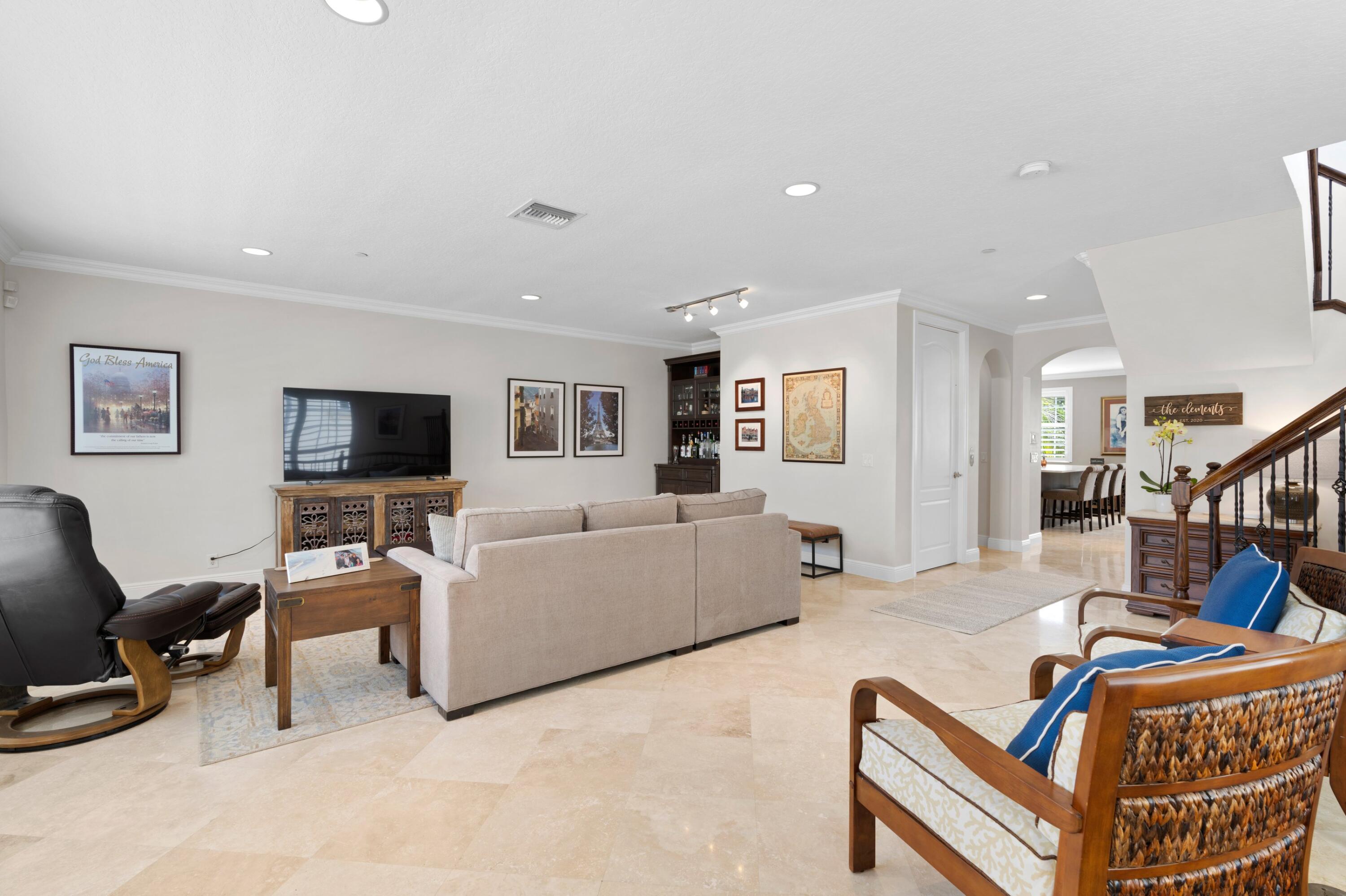 648 Northeast Francesca Lane Boca Raton, FL 33487 - Photo 8 of 40 a living room with furniture and a flat screen tv