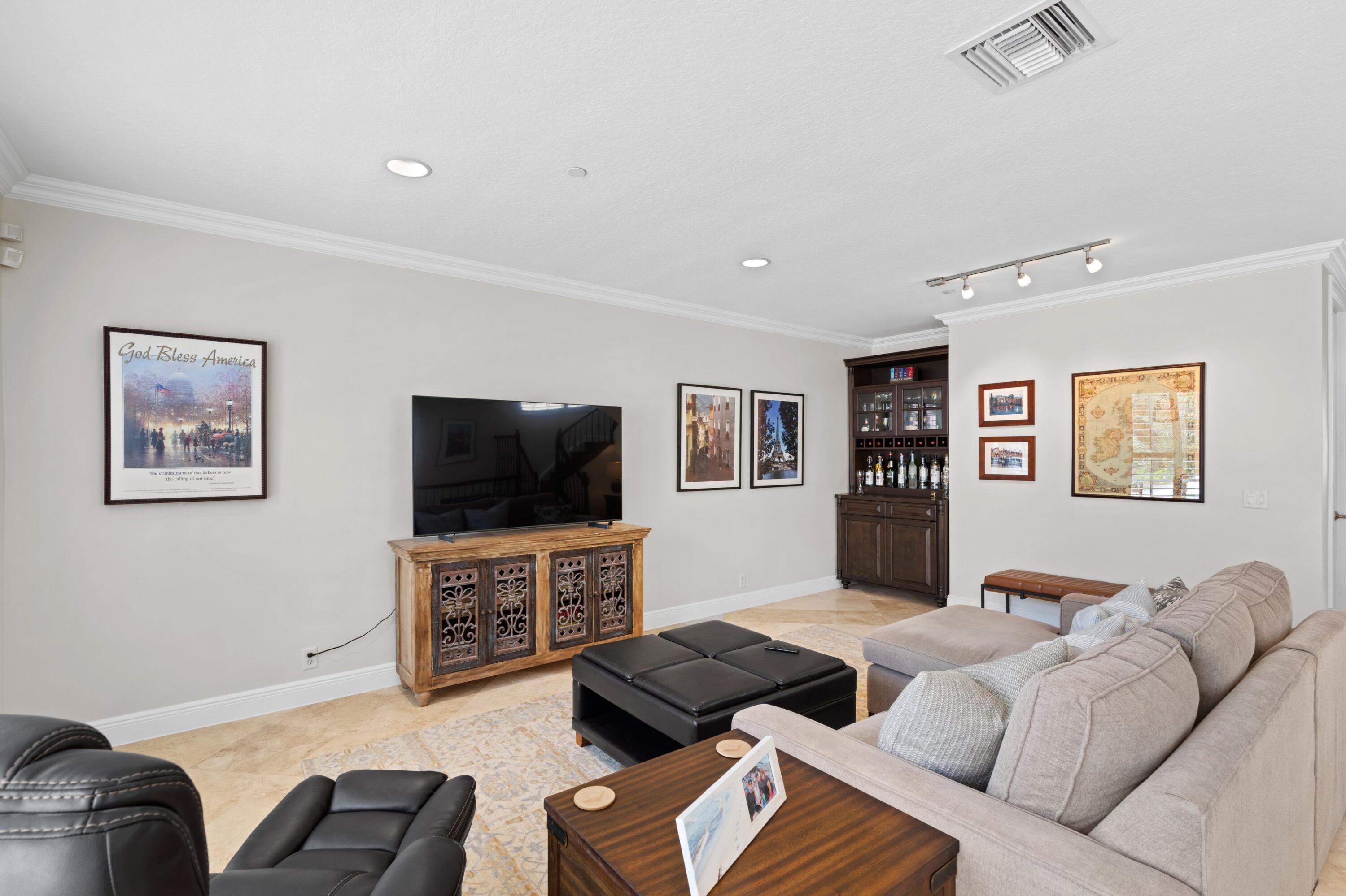 648 Northeast Francesca Lane Boca Raton, FL 33487 - Photo 9 of 40 a living room with furniture and a flat screen tv