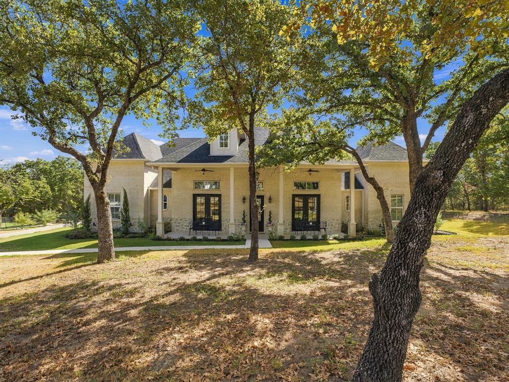 330 Rolling Bnd Road Alvord, TX 76225 - Photo 1 of 36 A beautiful French Traditional style home surrounded by mature trees in a peaceful, private setting.