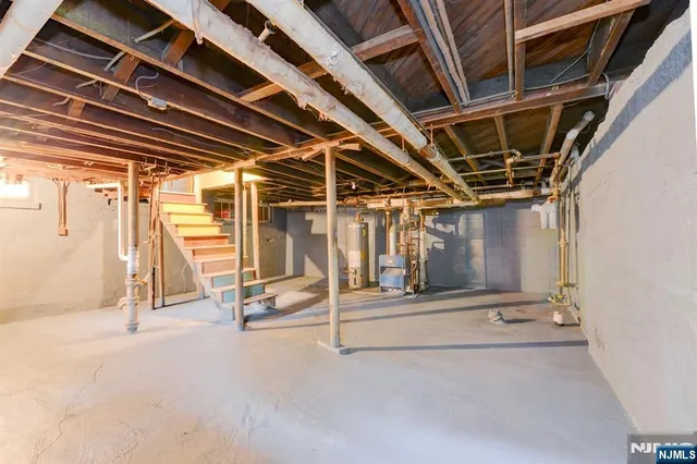 a view of an empty room with wooden roof