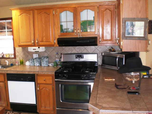a view of a dining room with furniture and window