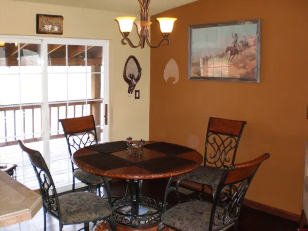 a kitchen with kitchen island granite countertop a sink stove and cabinets
